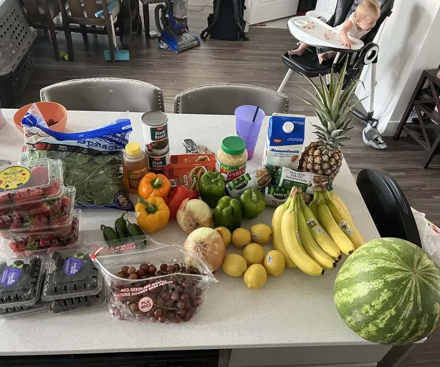 A week of real groceries laid out on a kitchen counter