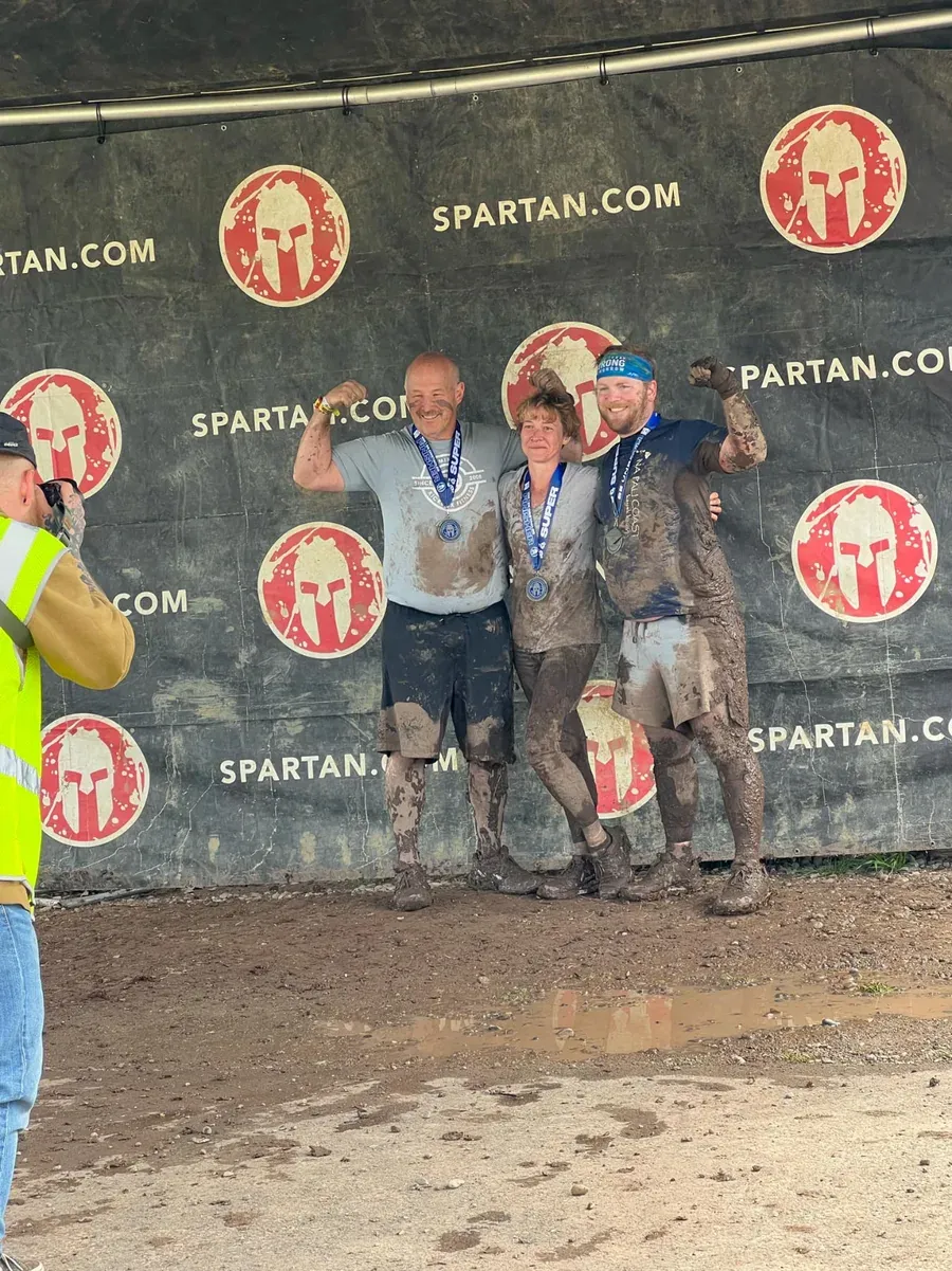 Knockout Lifestyle members at the finish of a Spartan race