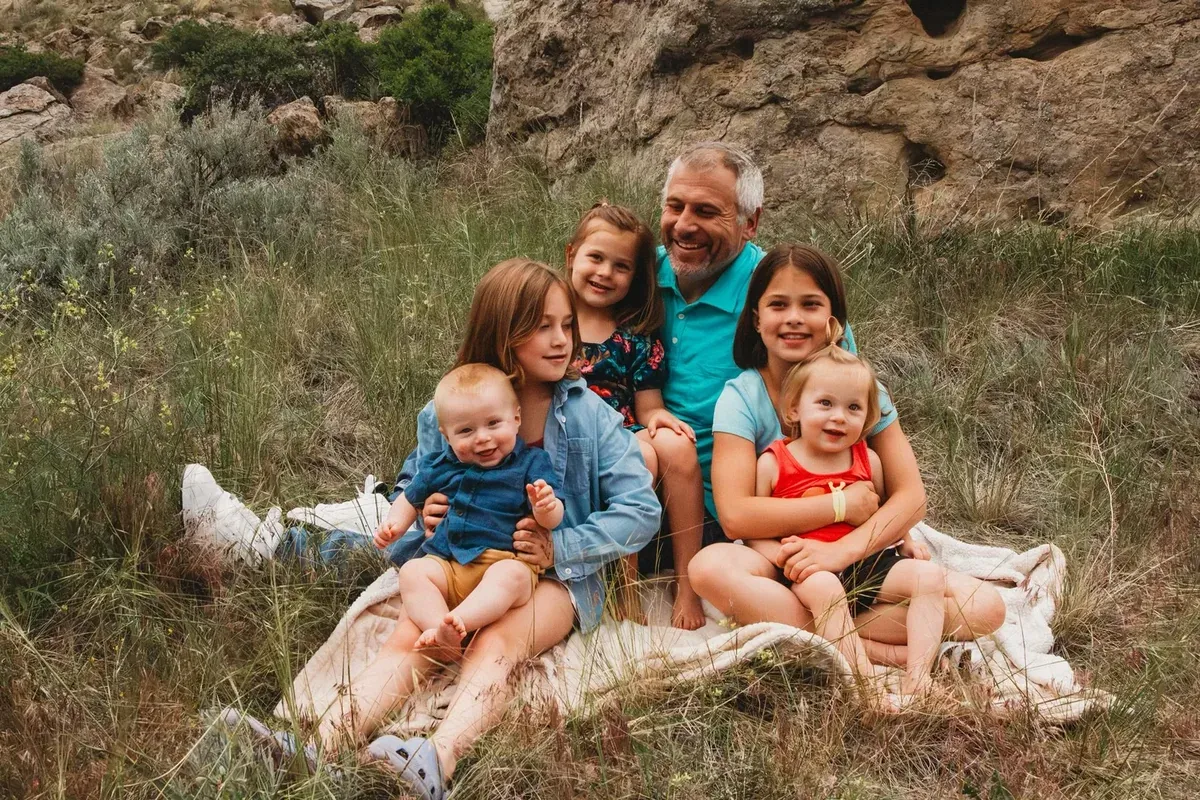 Corey Willis with his five kids in the Montana hills